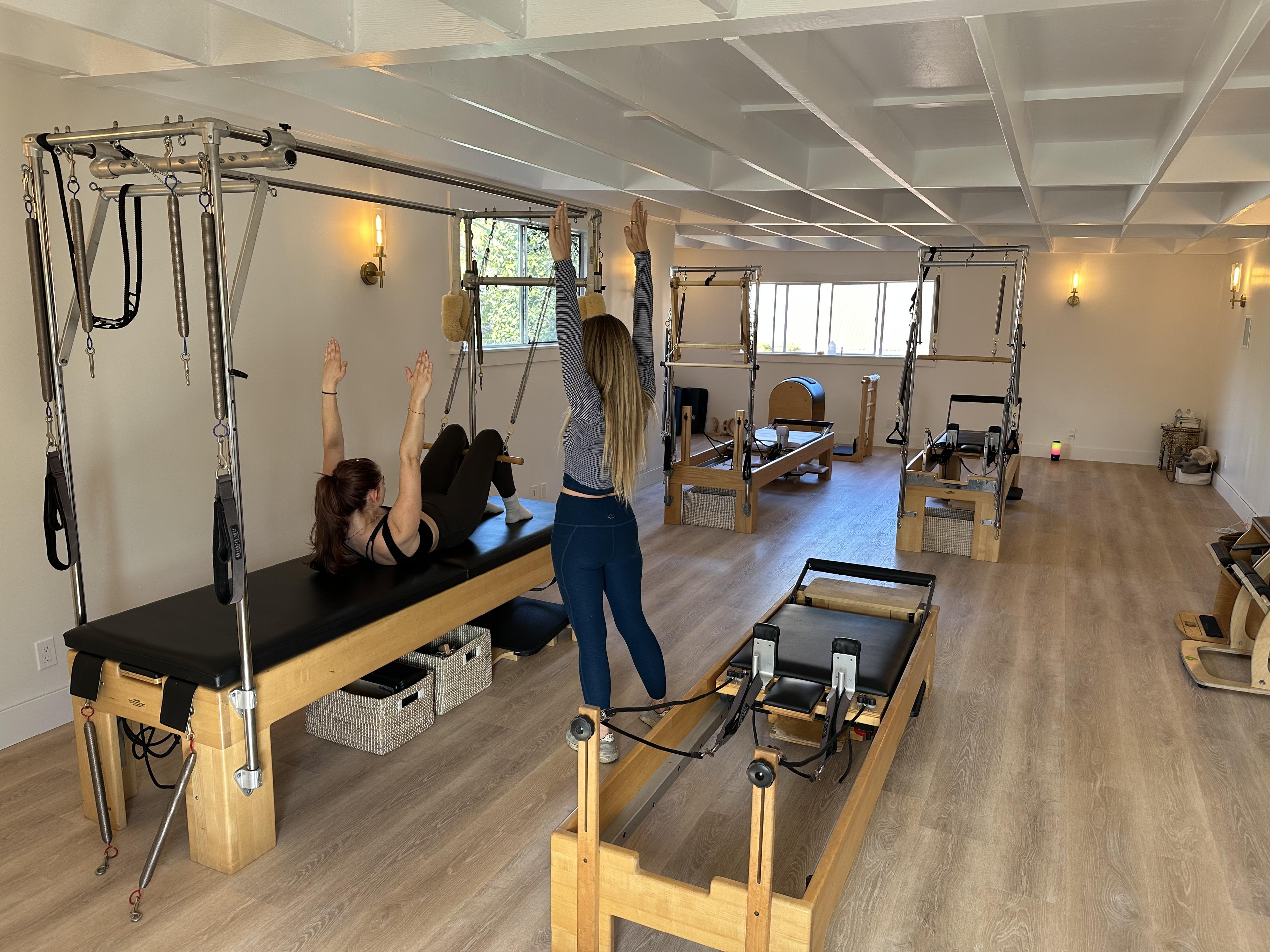 Inside the studio — reformers, Cadillacs, and a ladder barrel